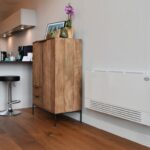 Ventilatorconvector voor lage temperatuur verwarming vervangt traditionele radiator in bestaande woning